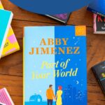 A copy of Part of Your World by Abby Jimenez is on the table.