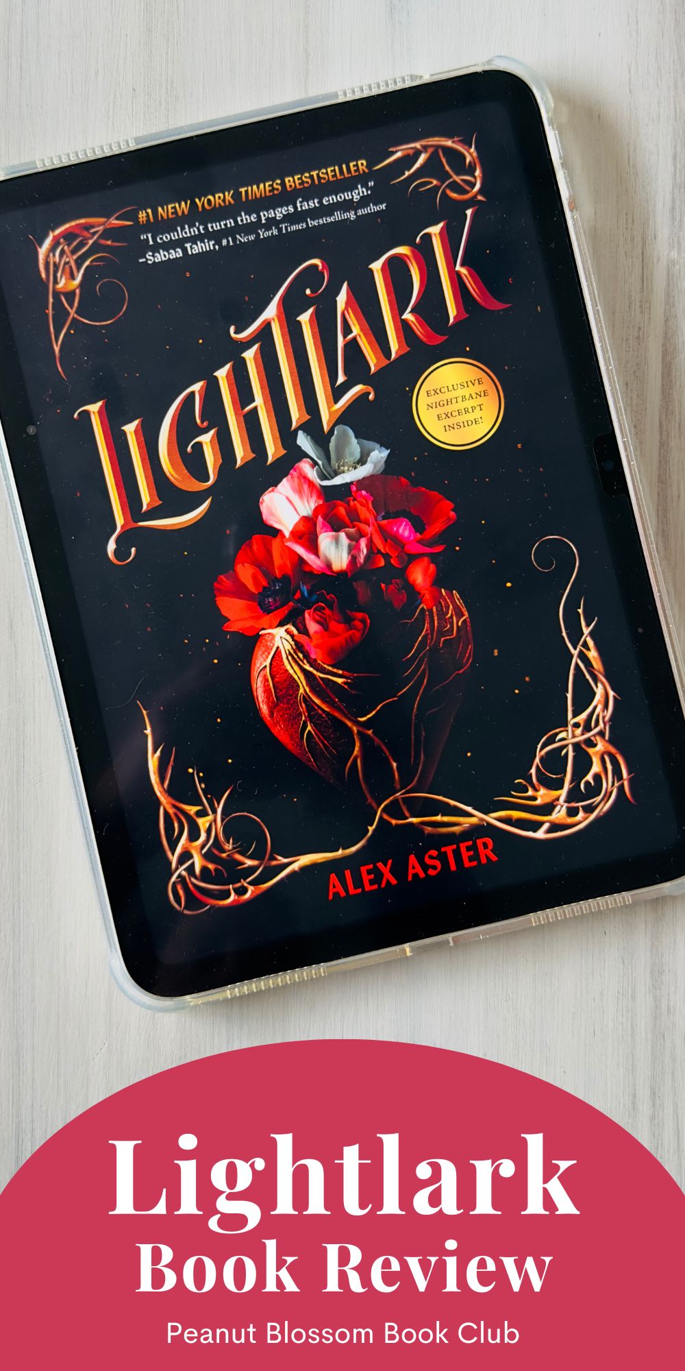 The cover of Lightlark by Alex Aster is on the screen of an ipad.