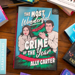 A copy of the book The Most Wonderful Crime of the Year by Ally Carter sits on the table.