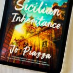 The cover of The Sicilian Inheritance by Jo Piazza is on the screen of an iPad.