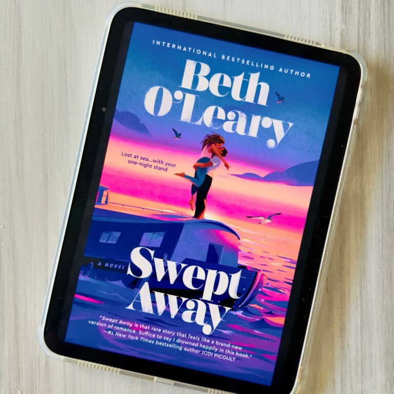 The cover of the book Swept Away by Beth O'Leary is on the screen of an iPad.