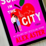 The cover of the book Summer in the City by Alex Aster is on the screen of an ipad.
