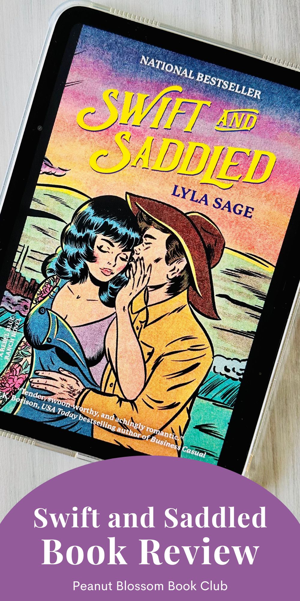 The cover of the book Swift and Saddled by Lyla Sage is on the screen of an iPad.