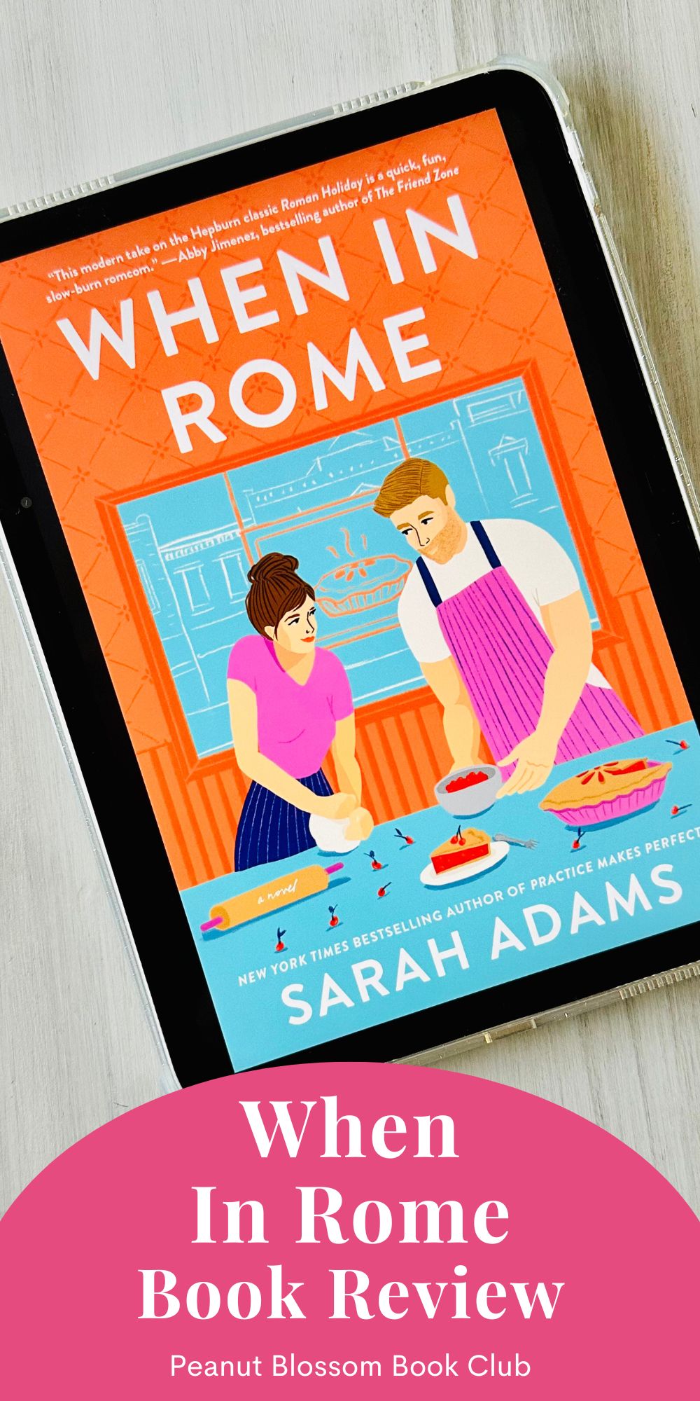The cover of the book When in Rome by Sarah Adams is on the screen of an iPad.