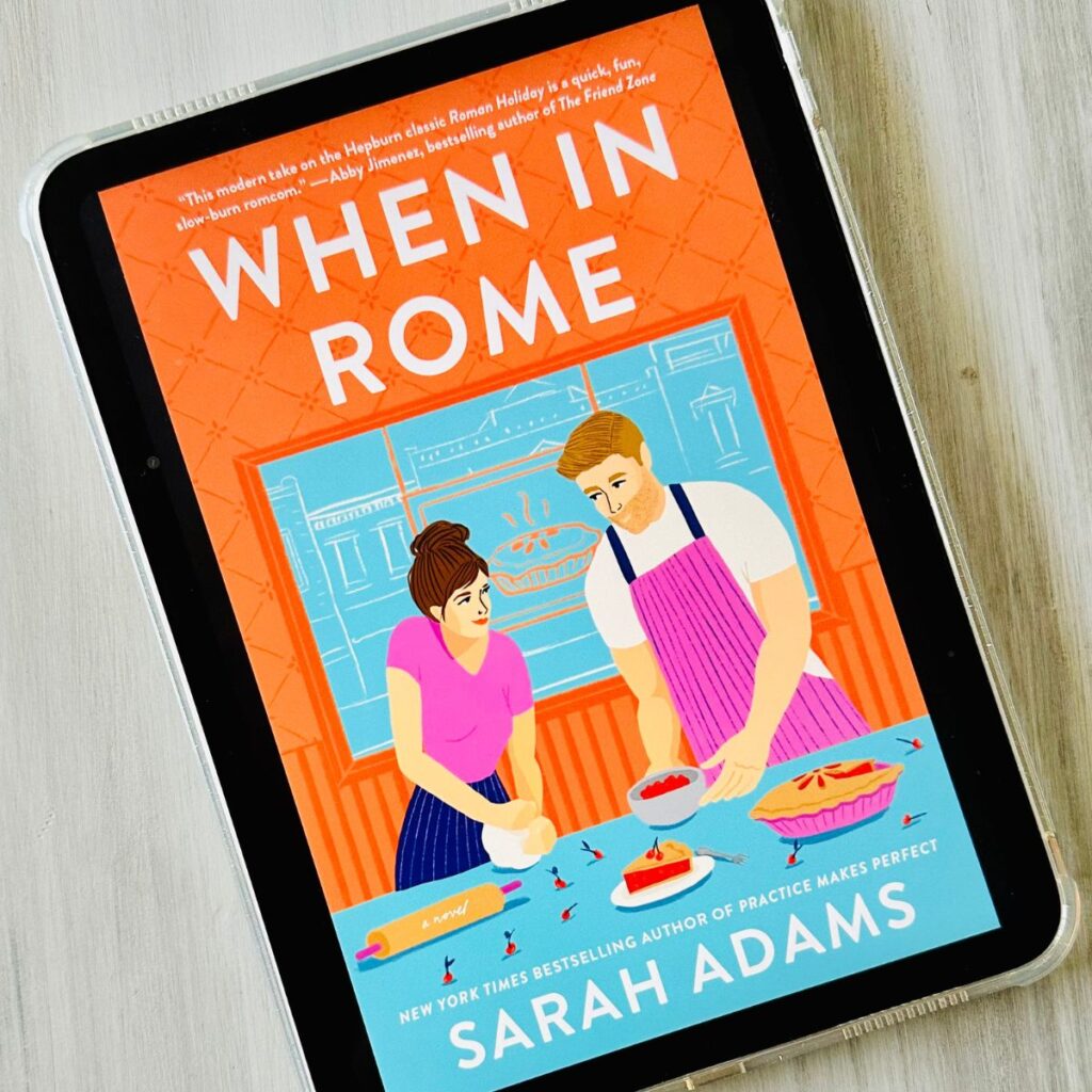 The cover of the book When in Rome by Sarah Adams is on the screen of an iPad.
