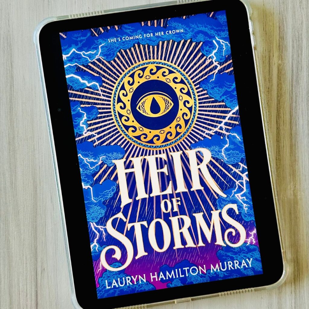 The cover of the book Heir of Storms by Lauryn Hamilton Murray is on the screen of an iPad.