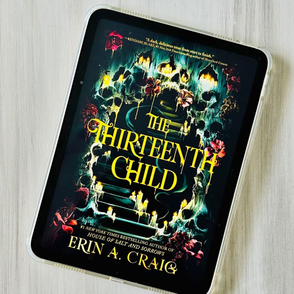 The cover of the book The Thirteenth Child by Erin A. Craig is on the ipad screen.