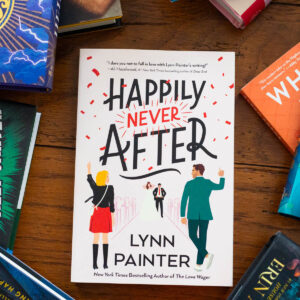 A copy of Happily Never After by Lynn Painter sits on the table.