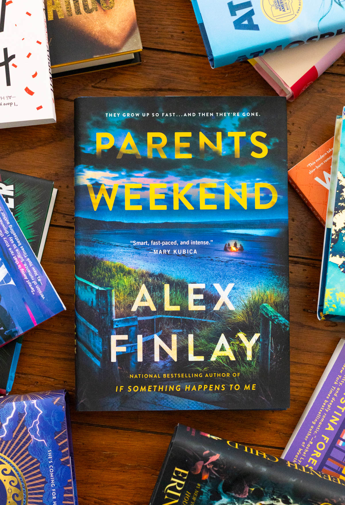 A copy of Parents Weekend by Alex Finlay sits on the table.