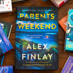 A copy of Parents Weekend by Alex Finlay sits on the table.