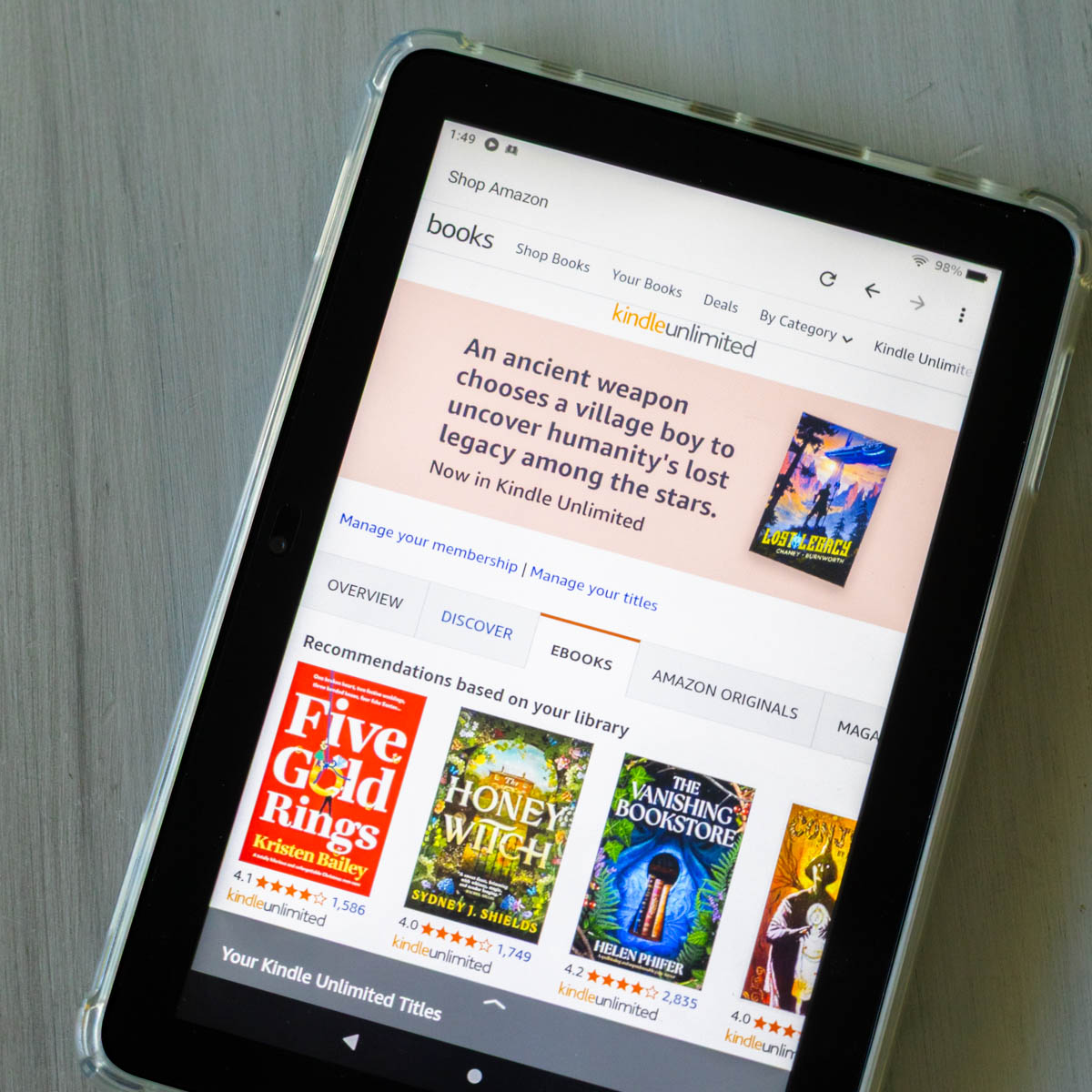 The Kindle Unlimited home page is on the screen of an Amazon Fire tablet.