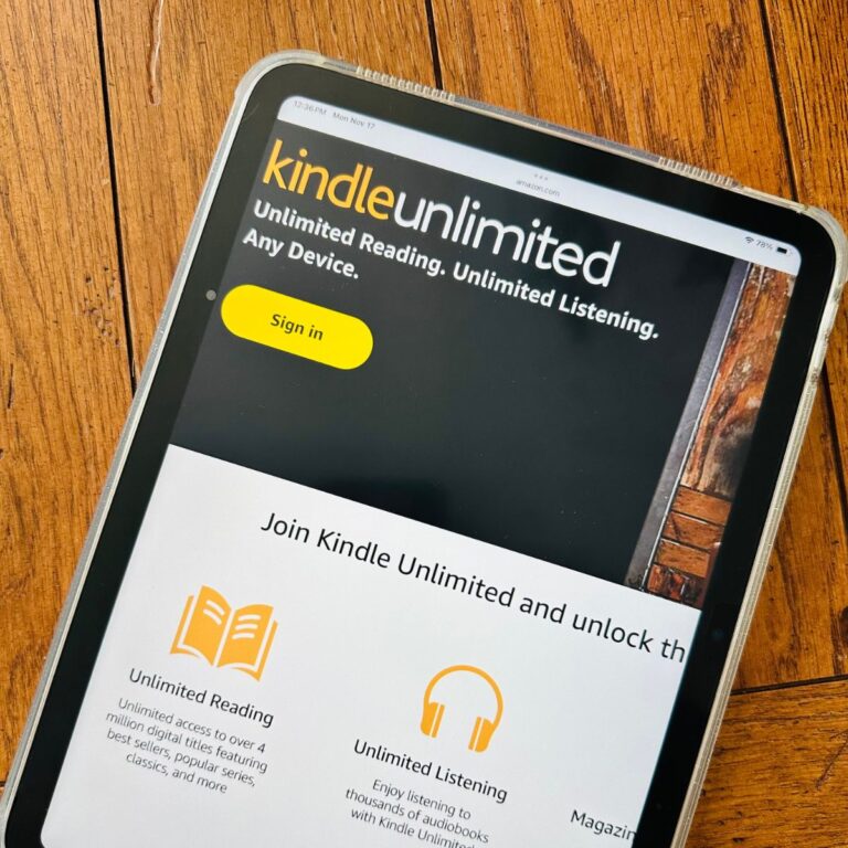 An iPad has the Kindle Unlimited subscription page up on the screen.