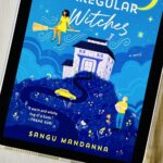 The cover of the book The Very Secret Society of Irregular Witches by Sangu Mandanna is on the screen of an iPad.