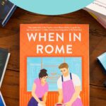 A copy of the book When in Rome by Sarah Adams sits on the table.