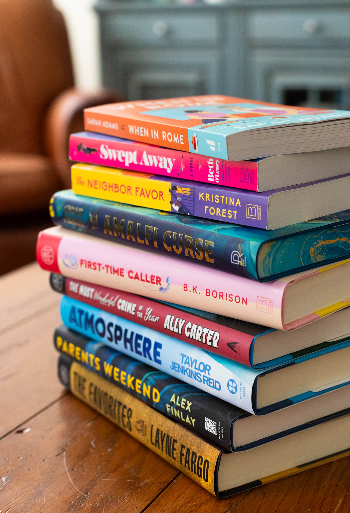 A stack of the best Book Club Books for 2026 sits on the table.