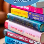 A stack of book club books for 2026 are on the table.