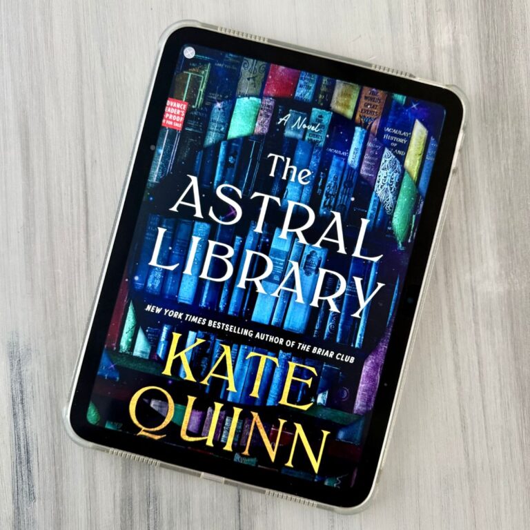 The cover of the book The Astral Library by Kate Quinn is on the screen of an iPad.